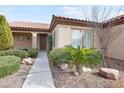 Well maintained single-story house featuring a welcoming entryway and desert landscaping at 2052 Powder Springs St, Henderson, NV 89052