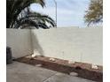 Fenced backyard with rock and minimal desert landscaping at 221 Oro Canyon St, Henderson, NV 89074