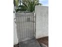 Gated entrance with block wall and desert landscaping accents at 221 Oro Canyon St, Henderson, NV 89074