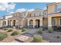 Charming townhome with desert landscaping, covered entryways, and tiled roofs at 3281 Pergusa Dr, Henderson, NV 89044