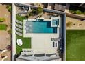 Stunning aerial view of a backyard oasis with pool, spa, and lounging area at 792 Drammatico Pl, Henderson, NV 89011