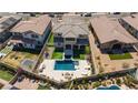 Stunning aerial view of backyard oasis with pool, spa, and lush landscaping at 11834 Albissola Ave, Las Vegas, NV 89138