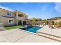 Inviting backyard pool with water feature and ample seating area at 11834 Albissola Ave, Las Vegas, NV 89138