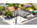 An aerial view showcases the home's layout, landscaping, and private pool in the backyard at 1700 Ivanhoe Way, Las Vegas, NV 89102
