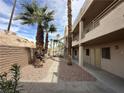 Exterior view of condo with desert landscaping and multiple levels at 2072 Mesquite Ln # 102, Laughlin, NV 89029
