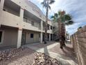 Exterior view of condo with multiple units and desert landscaping at 2072 Mesquite Ln # 102, Laughlin, NV 89029