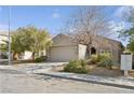 Inviting single-Gathering home with desert landscaping, a two-car garage, and a neutral-toned exterior at 2839 Strathallan Ave, Henderson, NV 89044