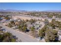 Aerial view of expansive home with large lot, pool and mature landscaping, set against the Las Vegas skyline at 2900 Thurman Ave, Las Vegas, NV 89120