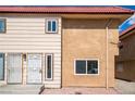 Charming exterior view of the apartment building featuring two-tone paint and desert landscaping at 2915 Cedar Ave # 12C, Las Vegas, NV 89101