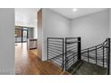 Modern hallway featuring sleek design, wooden floors, and open access to a kitchen area at 353 E Bonneville Ave # 183/283, Las Vegas, NV 89101