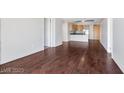 Open living room boasts sleek hardwood flooring and an open concept design that leads to the kitchen at 353 E Bonneville Ave # 375, Las Vegas, NV 89101