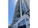 Modern high-rise condo building with floor-to-ceiling windows and multiple private balconies at 353 E Bonneville Ave # 515, Las Vegas, NV 89101