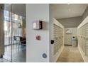 Hallway of modern building with mailboxes, featuring glass-enclosed lounge area at 353 E Bonneville Ave # 515, Las Vegas, NV 89101