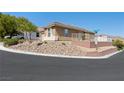 Corner home with desert landscaping and retaining wall at 4016 Balsam Mountain St, Las Vegas, NV 89129