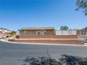 Exterior view of a single story home on a terraced corner lot with desert landscaping at 4016 Balsam Mountain St, Las Vegas, NV 89129