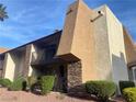Attractive condo with a private balcony, accented by stone and well manicured shrubbery at 4370 Sandy River Dr # 24, Las Vegas, NV 89103