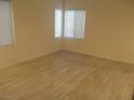 Clean, bright bedroom with ample natural light shining through the windows at 5481 Railroad River Ave, Las Vegas, NV 89139