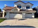 Elegant two-story home boasting a three-car garage and lush greenery at 8132 Bay Harbor Dr, Las Vegas, NV 89128