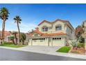 Stunning two-story home showcasing a three-car garage, desert landscaping, and a classic red tile roof at 8132 Bay Harbor Dr, Las Vegas, NV 89128