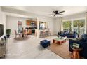 Open floor plan with dining area, bar seating, and living room with a sliding glass door to a balcony at 1405 Vegas Valley Dr # 226, Las Vegas, NV 89169