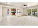 Bright and airy living room featuring wood-look floors, neutral walls, and a sliding glass door to a balcony at 1405 Vegas Valley Dr # 226, Las Vegas, NV 89169
