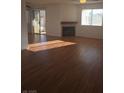 Spacious living room with fireplace, ceiling fan, hardwood floor and natural lighting at 2232 Aspen Mirror Way # 204, Laughlin, NV 89029