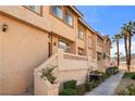 Inviting townhouse exteriors with well-manicured landscaping and covered front entryways at 3426 Dry Gulch Dr, Laughlin, NV 89029