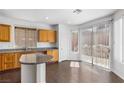 Bright kitchen featuring modern countertops, cabinetry and natural light from a sliding glass door at 3637 Pinnate Dr, Las Vegas, NV 89147
