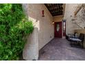 Charming entrance with decorative door, textured walls, and outdoor seating area at 3949 S Torrey Pines Dr, Las Vegas, NV 89103