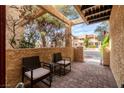 Cozy outdoor patio featuring brick flooring and comfortable seating area at 3949 S Torrey Pines Dr, Las Vegas, NV 89103
