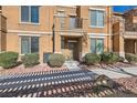 Inviting home exterior with neat landscaping, small bushes, stone accents, and shaded walkway to front door at 5179 Silica Chalk Ave, Las Vegas, NV 89115