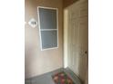 Close up of a unit front door and screen, located on an exterior walkway, with unit number visible at 5751 E Hacienda Ave # 159, Las Vegas, NV 89122