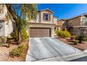 Two-story home featuring a neutral stucco exterior, complemented by a well-maintained yard, and a two-car garage at 6476 Little Harbor Ct, Las Vegas, NV 89141
