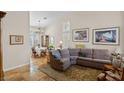 Inviting living room with high ceilings, travertine floors, and elegant decor at 8125 Boxberry Ave, Las Vegas, NV 89131