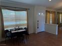Inviting entryway with tile floors, draped windows, and front door at 8154 Flanders Terrace Dr, Las Vegas, NV 89123