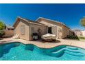 Backyard pool with a well-maintained patio, perfect for outdoor relaxation and entertainment at 8266 Lincoln Valley St, Las Vegas, NV 89123