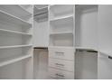 Spacious walk-in closet featuring custom shelving and ample storage for organized living at 10001 Peace Way # 1321, Las Vegas, NV 89147