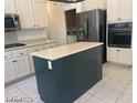 Kitchen with stainless steel appliances and a center island at 1297 Peppercorn Ave, Henderson, NV 89012