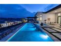 Sparkling pool and integrated spa with scenic views, ideal for relaxation and entertaining at 148 Tre Pietre St, Henderson, NV 89011