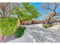 Charming single-story home featuring a well-manicured lawn and lengthy concrete driveway at 2809 Gilmary Ave, Las Vegas, NV 89102