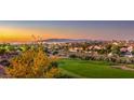 Scenic view of the golf course and Las Vegas city lights at sunset at 2994 San Lorenzo Ct, Henderson, NV 89052