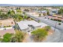Aerial view of a light colored home with mature trees and neighborhood setting at 3101 Margarita St, Pahrump, NV 89048