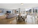 Open living and dining area featuring contemporary decor and access to outdoor views at 3111 Bel Air Dr # 3C, Las Vegas, NV 89109