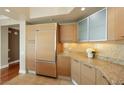 Bright kitchen featuring granite countertops, stainless steel appliances, and wooden cabinetry at 322 Karen Ave # 708, Las Vegas, NV 89109