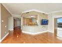 Open-concept space with wood floors, kitchen, and access to the balcony at 322 Karen Ave # 708, Las Vegas, NV 89109