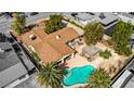 Aerial view of a private backyard oasis with pool, spa, covered patio, gazebo, desert landscaping, and mature trees at 4343 Sharpshooter Ln, North Las Vegas, NV 89031