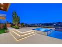Outdoor area with hot tub and lounge area; featuring modern tile work and city views at 49 Crested Cloud Way, Las Vegas, NV 89135