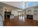 Bright living room with hardwood floors, fireplace, and abundant natural light at 5256 Harvest Breeze Rd, Las Vegas, NV 89118