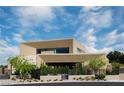 Modern home showcasing clean lines, desert landscaping, and a spacious covered entrance at 751 Wexler Ct, Las Vegas, NV 89107
