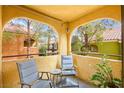 Cozy balcony with seating offers a relaxing outdoor space with neighborhood views at 7950 W Flamingo Rd # 2142, Las Vegas, NV 89147